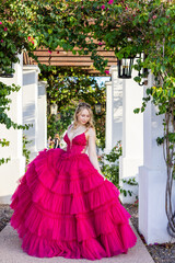 teen girl posing for photos in a beautiful pink party dress © Joanne