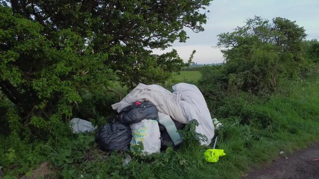 Fly tipping, garbage dumping in UK countryside..