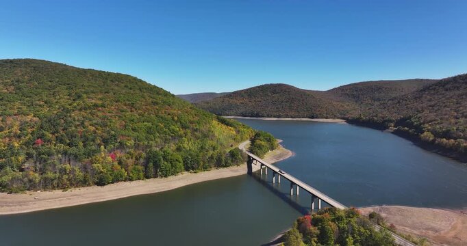 Autumn aerial video of the bridge of the Cannonsville Reservoir, Delaware County, NY, NYC DEP water supply, October 2025.