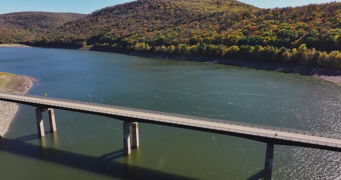 Autumn aerial video of the bridge of the Cannonsville Reservoir, Delaware County, NY, NYC DEP water supply, October 2025.
