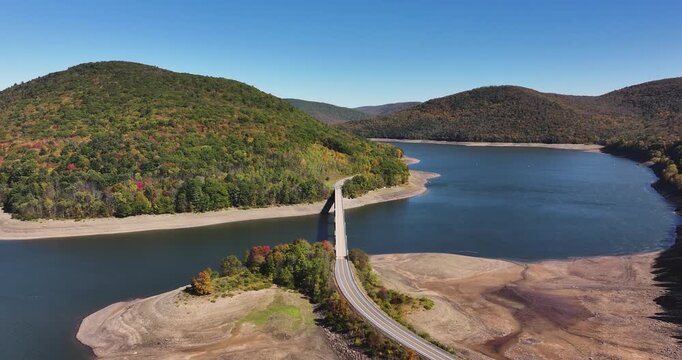 Autumn aerial video of the bridge of the Cannonsville Reservoir, Delaware County, NY, NYC DEP water supply, October 2025.