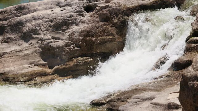 Close-up of Rushing White Water Rapids and Limestone Rock