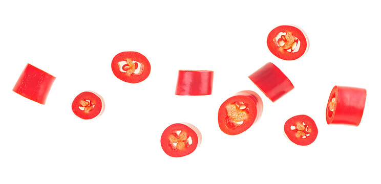 Red sliced chili pepper isolated on a white background, top view. Fresh mexican hot cayenne spicy.