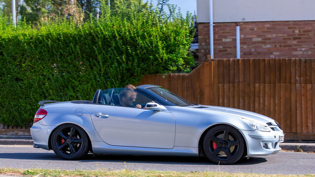 Bletchley,Bucks,UK - Aug 25th 2025:  2004 Mercedes benz slk 350 car driving on a British road