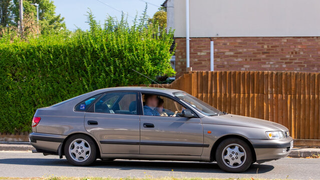 Bletchley,Bucks,UK - Aug 25th 2025: 1996 Toyota Carina classic  car driving on a British road