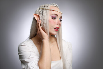 Naklejka premium Beautiful elf girl on grey gradient background