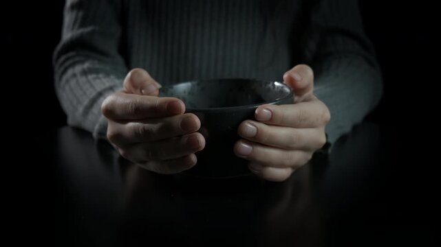 Young hunger hands waiting for meal. An younger with no meal stand by the table during hungry time