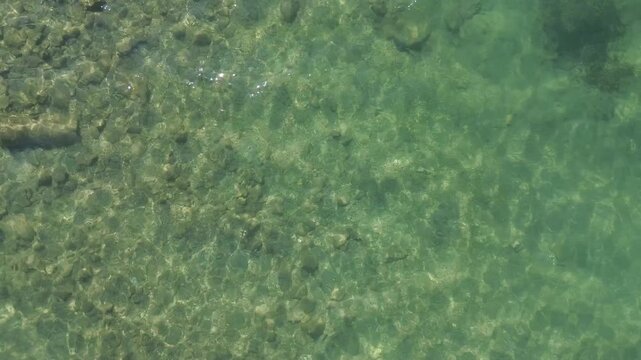 Aerial Drone Flying Over Shallow Sea Towards Shore in Izmir Turkiye