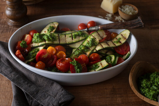 Roasted zucchini with tomatoes and pesto
