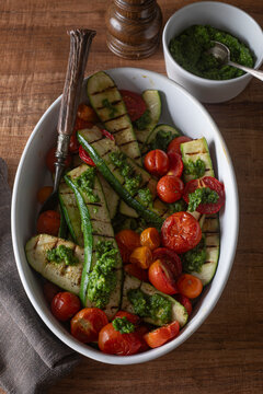 Roasted zucchini with tomatoes and pesto