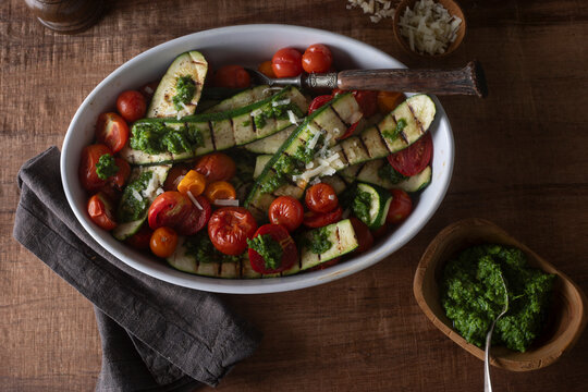 Roasted zucchini with tomatoes and pesto