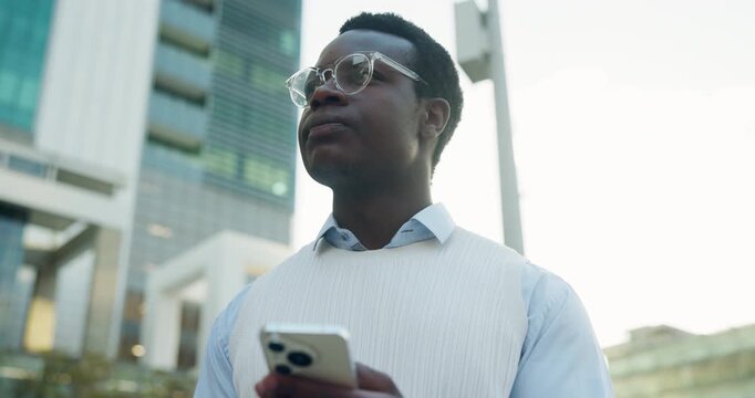 Serious, businessman and thinking with phone in city, travel and searching for directions on website. Employee, reflection and black person with digital map, low angle and commute with mobile on road