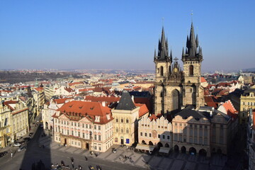 Obraz premium High angle view of the Old Town Square and the Church of Mother of God before Tyn in Prague, Czech Republic. Beautiful Gothic architecture under a clear blue sky.