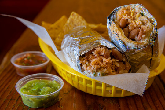 Rice and bean burrito in yellow basket