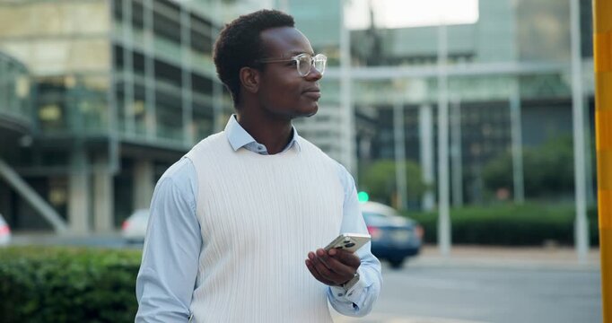 Businessman, online and thinking with phone in city, travel and searching for directions on website. Employee, reflection and black person with smile for digital map, network and commute with mobile