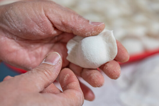 Fresh made dumpling in hand