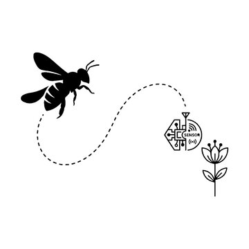 Black bee flying to flower.