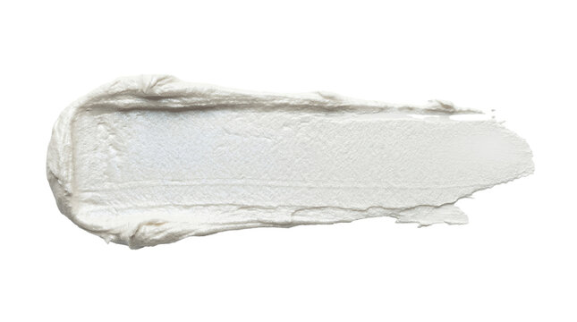 Close up of white cosmetic cream smear on isolated background, beauty and skincare concept for advertising
