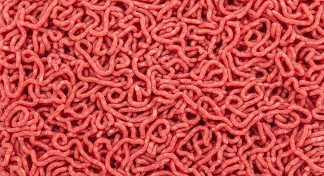 Close up texture of fresh raw minced beef meat showing intricate red patterns.