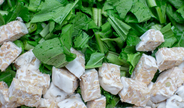 Chop mustard greens and tempeh raw before cooking
