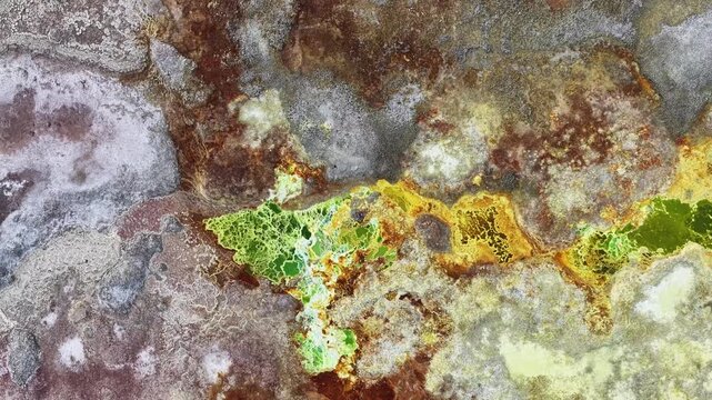 Aerial view of the vibrant sulfur pools and salt crusts of the Danakil Desert in Dalol, Afar, Ethiopia.