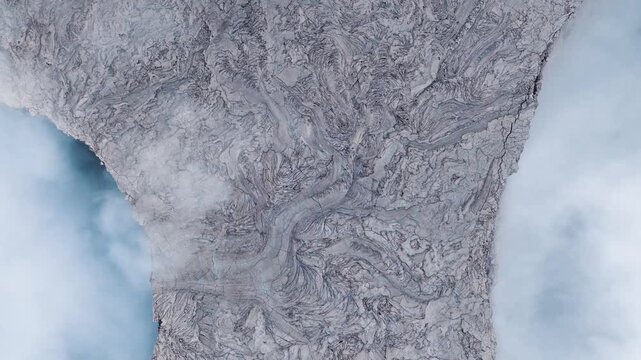 Aerial view of the swirling solidified lava flows and volcanic textures at Erta Ale Volcano in Danakil Desert, Afar, Ethiopia.