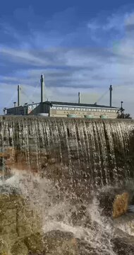 San Antonio, Texas, USA - December 2, 2025:  Exterior vertical video of the San Antonio Alamodome, a multi-purpose stadium, with water feature in the foreground.