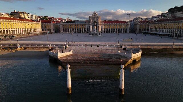 Aerial view of Praca do Comercio with the Rua Augusta Arch and Cais das Colunas at sunset in Lisbon, Lisbon, Portugal.