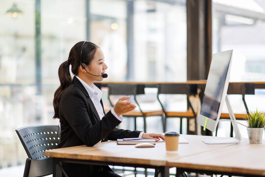 Customer service operator working in modern office communicating