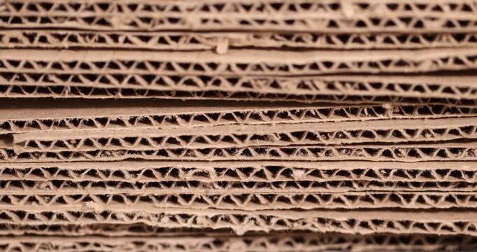 old crumpled cardboard folded for storage, used old cardboard from recycled paper is stored after using it as packaging material, cardboard box