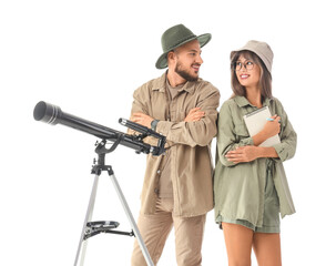 Fototapeta premium Young couple of travelers with telescope on white background