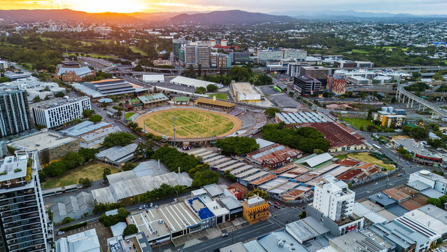 Aerial View of Bowen Hills Brisbane at Sunset with RNA Showgrounds and City Skyline