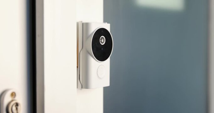 Man pressing button on intercom panel indoors, closeup. Camera moving in