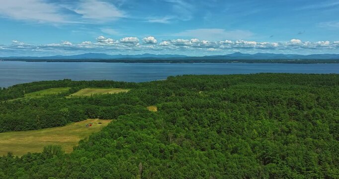 Willsboro, NY, USA  July 22, 2025  Aerial timelapse video over Willsboro Point, in Town of Willsboro NY  and Lake Champlain at the foot of New York's Adirondack Mountains.