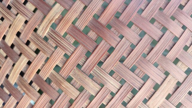 Natural brown bamboo strips woven in a detailed diagonal pattern.