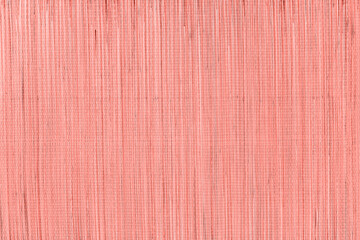 Fototapeta premium Surface texture showing vertical lines and patterns in light pink color during daylight