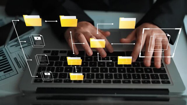 Hands Typing on Laptop Keyboard with Organized Digital Folders and Flowchart Elements Representing Data Management and Information Organization Gluon.
