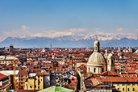 Panoramic view of the city of Turin, Italy, showing the historic city center rooftops with the snowy Alps in the background, Northern Italy, Europe