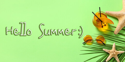 Fototapeta premium Banner with text HELLO SUMMER, sunglasses and glass of cocktail on green background