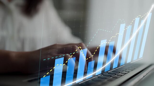 Capture of hands typing on a laptop with a digital graph overlay, symbolizing business growth and financial success in a modern workspace. Ideal for finance and analysis themes. Copula