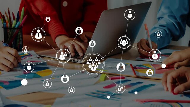 Diverse team collaboration around a laptop with data visualization and creative brainstorming on paper designs for innovative project solutions Gluon.