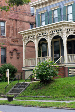 Classic Urban Residence Showcasing Decorative Iron Balustrades And Lush Plants new york