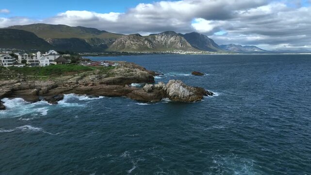 Aerial drone view with seaside cliffs in Hermanus, South Africa.