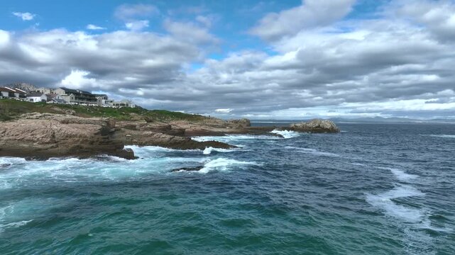 Drone flight along the seaside cliffs in Hermanus in South Africa.