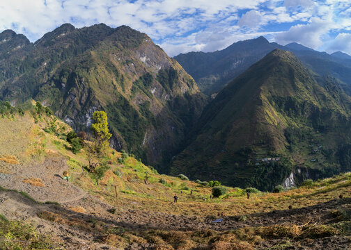 Majestic mountain landscape with dramatic peaks, rolling hills, and scenic natural beauty under a clear sky. Perfect travel and nature background from the Himalayas of Nepal.
