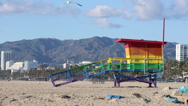 Colorful Life Guard Stand On Beach With Hills