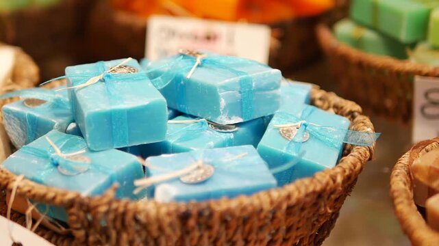 Handmade soaps displayed in a market basket