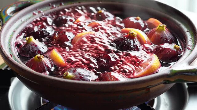 Delicious Homemade Fig and Peach Compote Simmering on Stove.