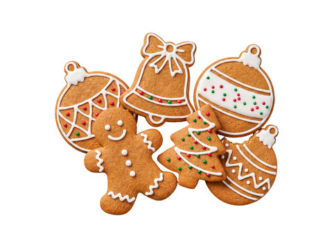 Festive homemade gingerbread cookies in classic Christmas shapes, decorated with white icing and colorful sprinkles.