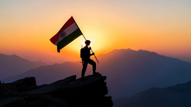 Silhouette of a soldier standing on a mountain peak holding the Indian flag at sunrise
